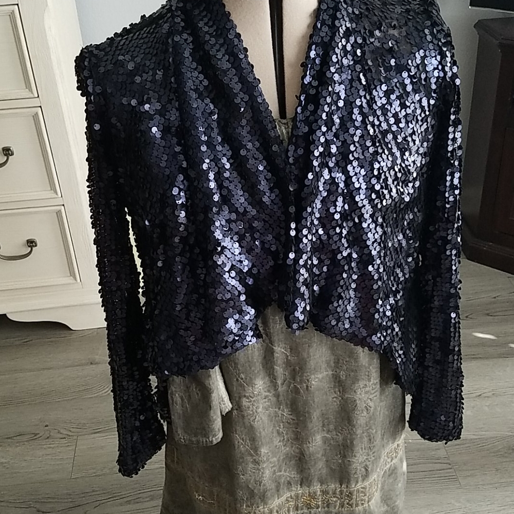 A dressy, beaded evening jacket